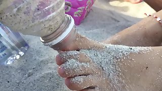 Young Hispanic Feet Massaged with Sand