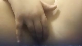 Young teenage girl plays with pussy