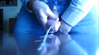 guy jerking off a huge dick and pouring himself with sperm. slow cum
