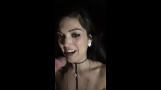 Young brunette films herself sucking hard cocks at the gloryhole