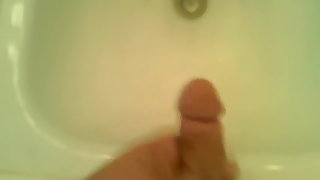 guy jerking off a huge dick and pouring himself with sperm