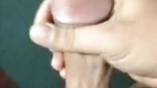 guy jerking off a huge dick and pouring himself with sperm