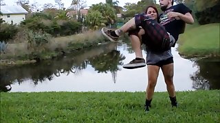 Beautiful girl easy lifting her male friend